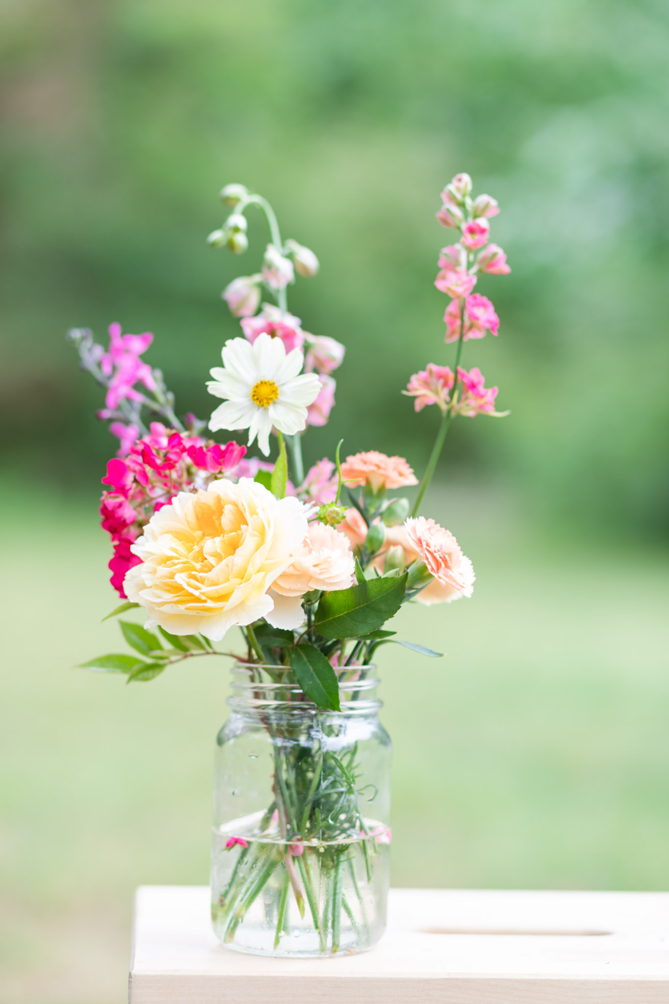 flowers arranged in a mason jar